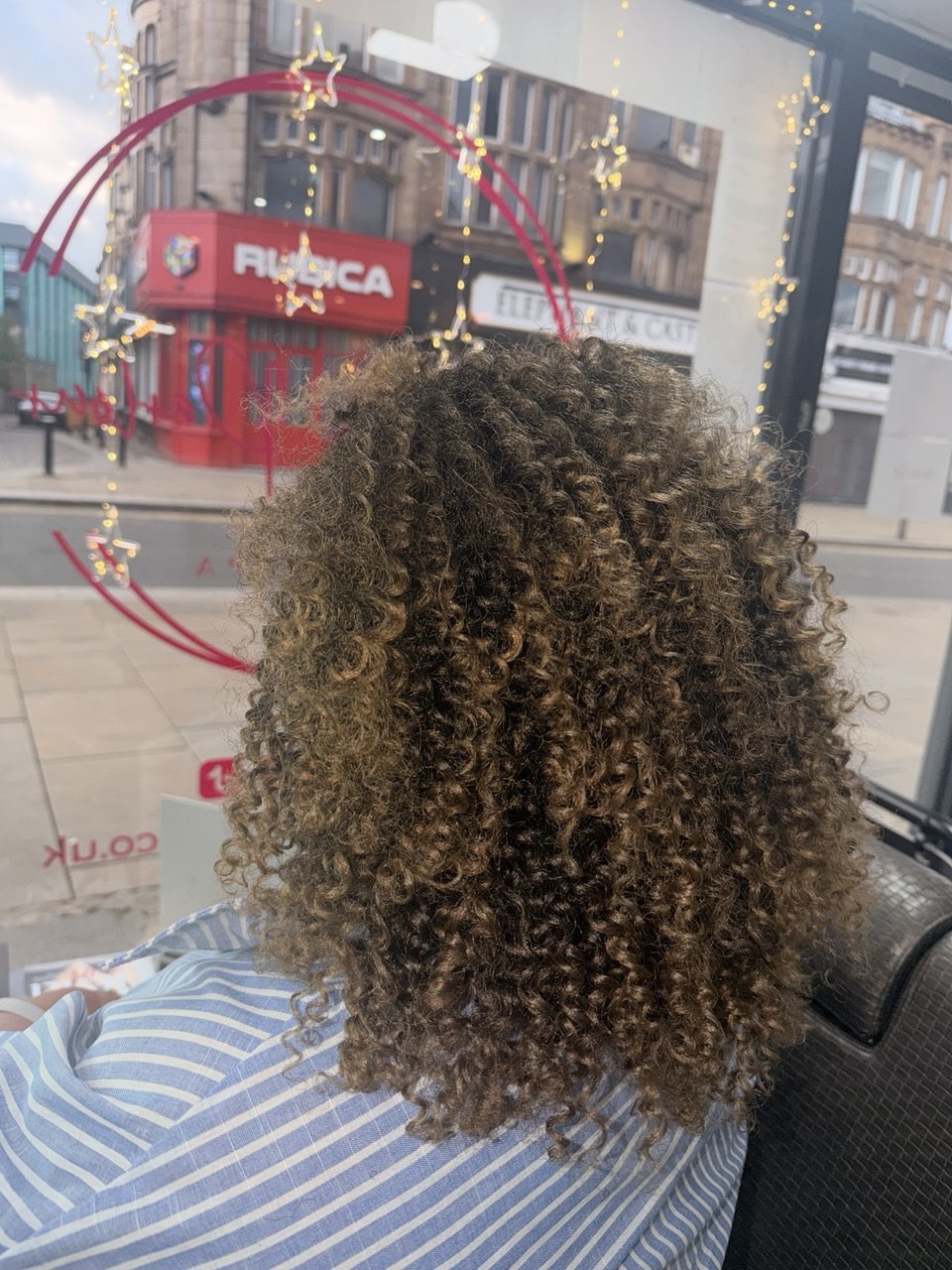 Healthy defined curls after an Afro hair care routine at Baddy's Parlour Bolton