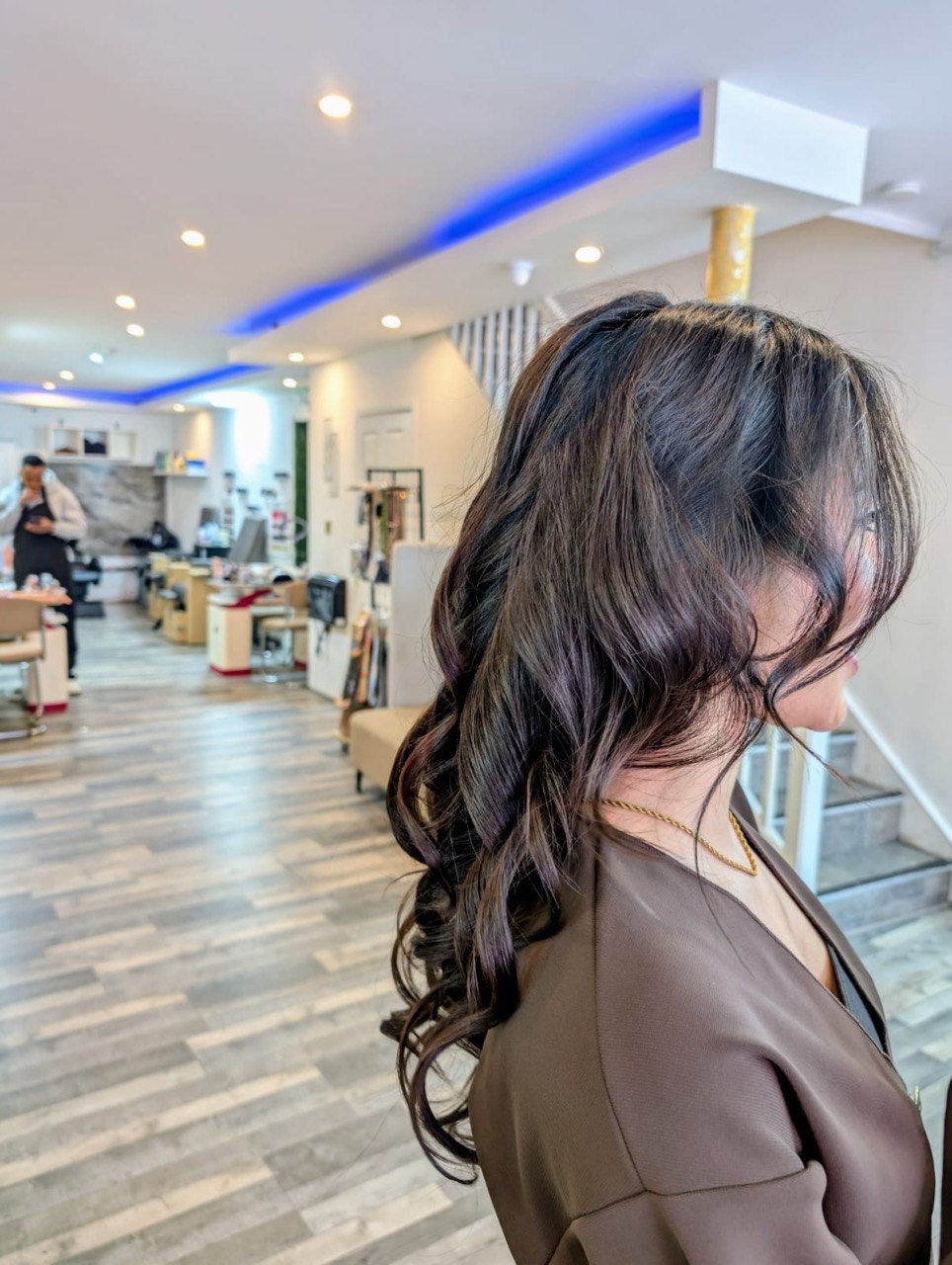 Long wavy brunette blow-dry at Baddys Parlour hair salon, Bolton